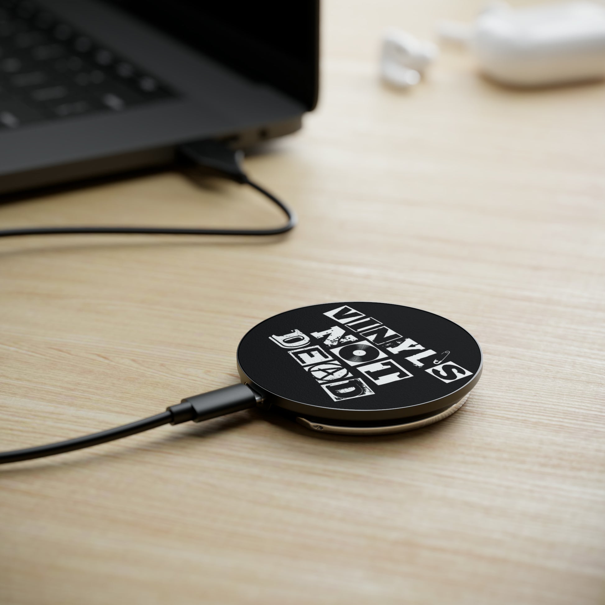 Vinyl Record Themed Magnetic Induction Charger with Vinyl is Not Dead Print on table